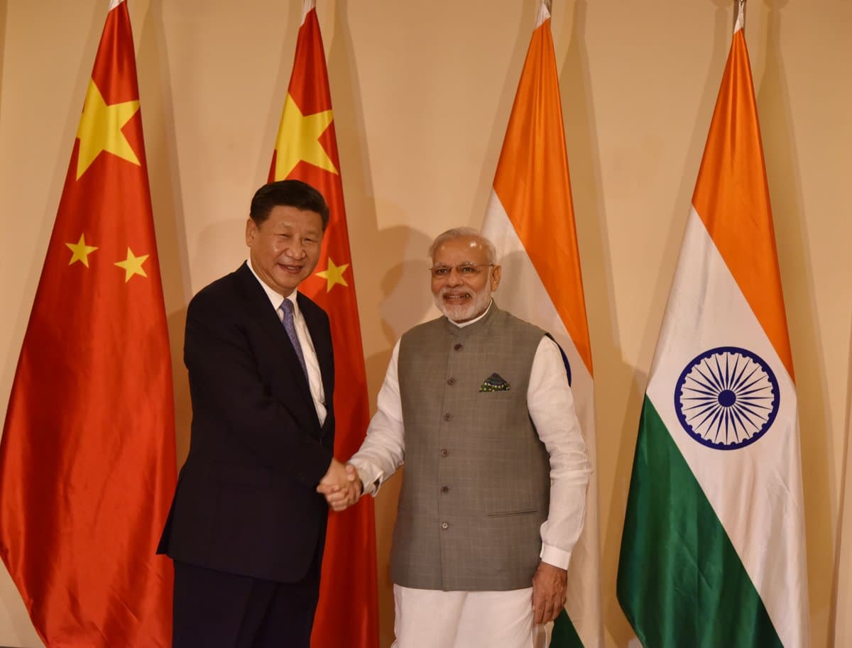 Indian Prime Minister Narendra Modi and Chinese President Xi Jinping agree to restore border peace and trade